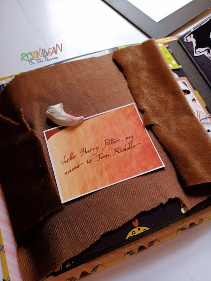 Hogwarts harry potter theme scrapbook with pictures on white backdrop