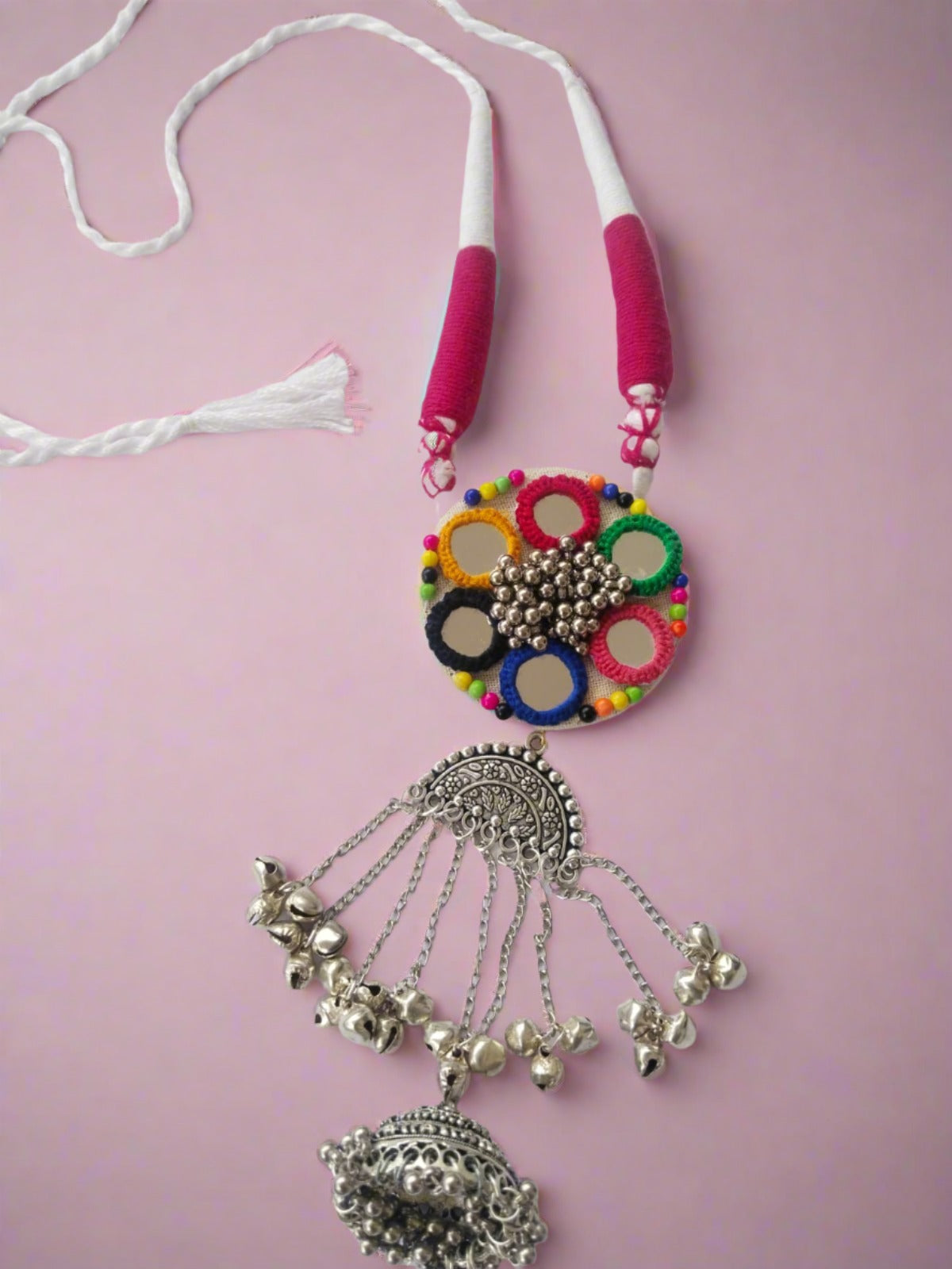 Multicolor fabric long necklace with mirrors and embroidery on white backdrop
