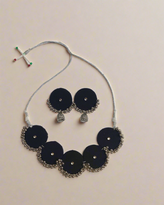 Black round shaped choker necklace and earrings with silver beads and jhumar at bottom