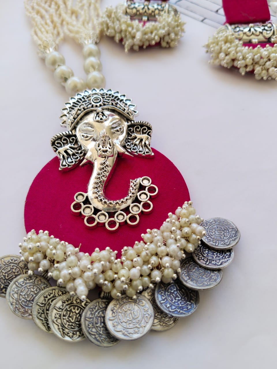 Dark pink necklace pendant with ganpati charm, white beads and silver coins