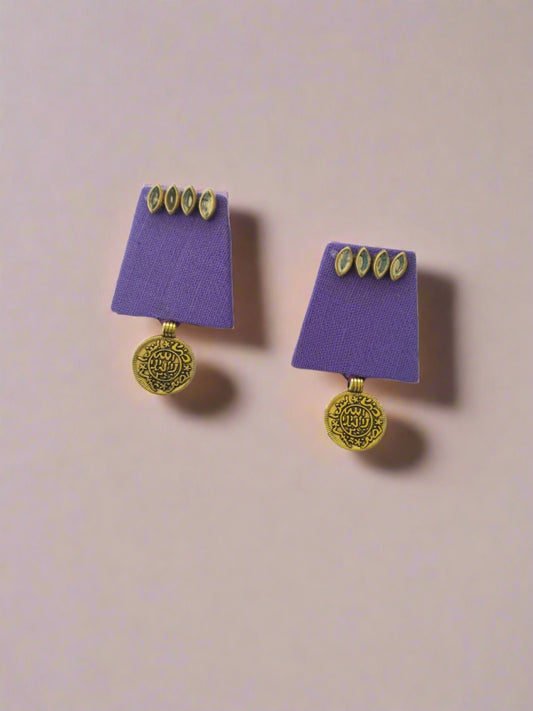 Purple mini rectangular earrings with golden coin and kundan on white grey backdrop
