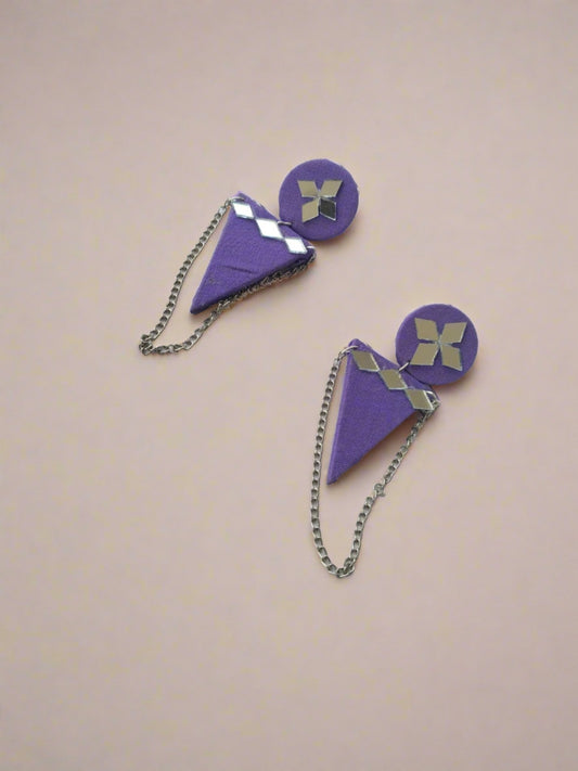 Purple round and triangular earrings with mirror details and silver chain on white backdrop