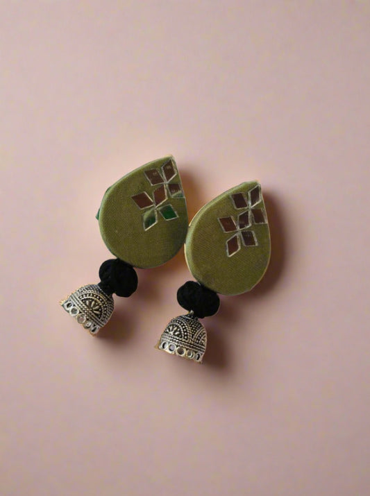 Light mehendi green earrings with black and silver bottom on white backdrop