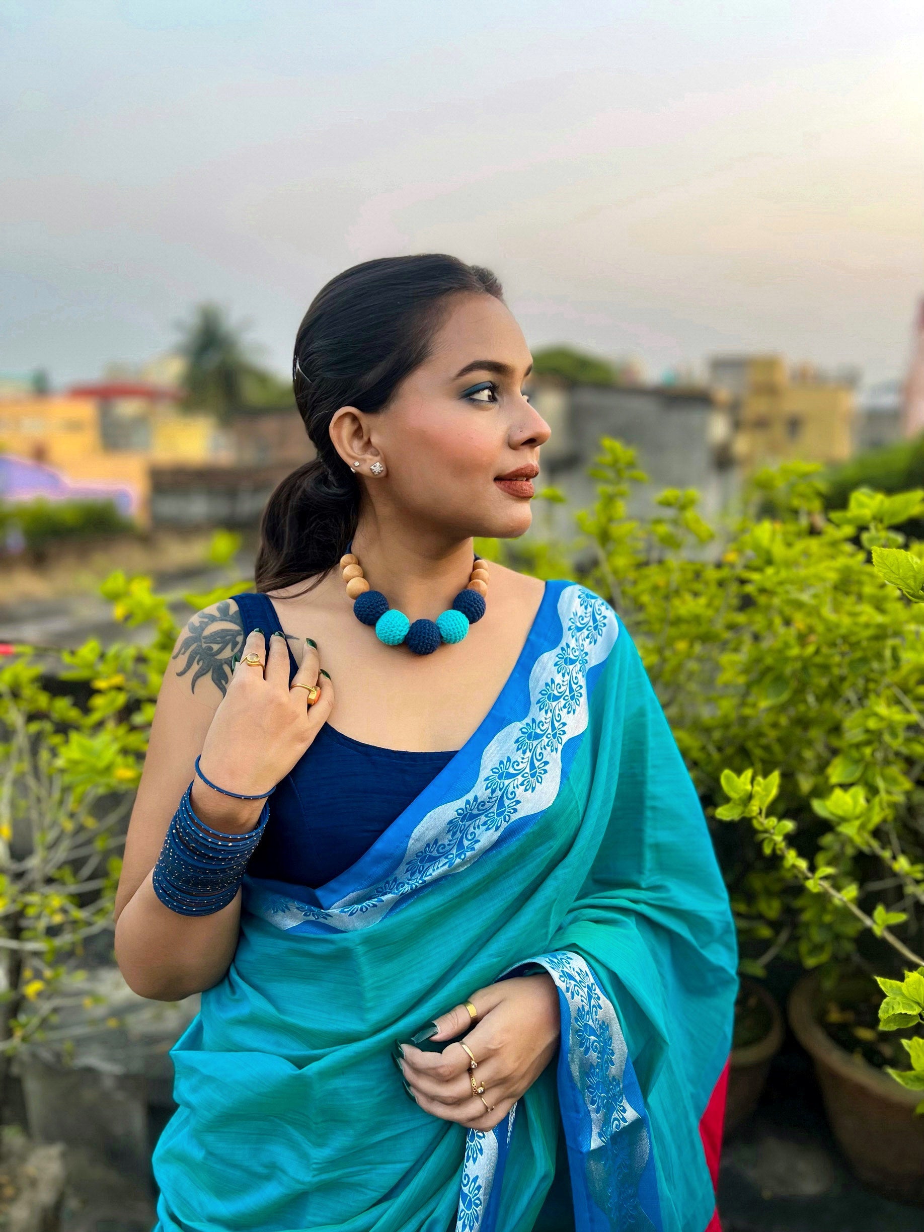 Indian woman wearing blue saree with Dark and light blue crochet round beaded choker necklace 